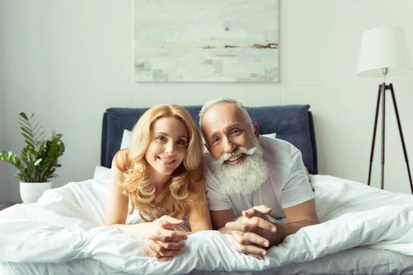 Mature couple in bed — Stock Photo