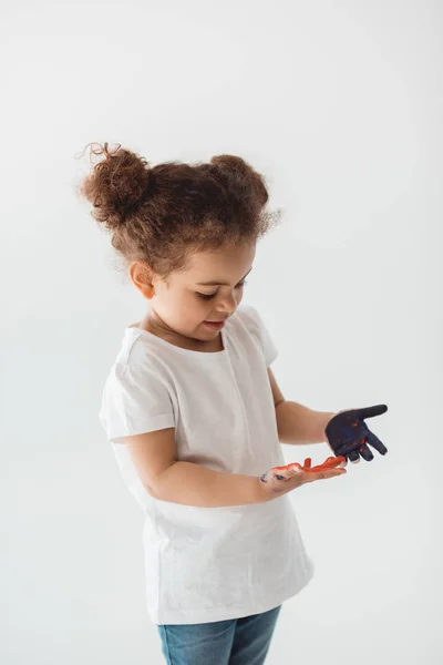 Little kid girl with painted hands — Stock Photo