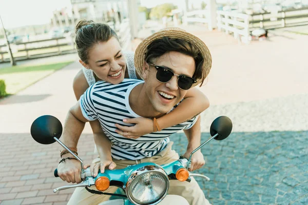 Couple riding retro scooter — Stock Photo
