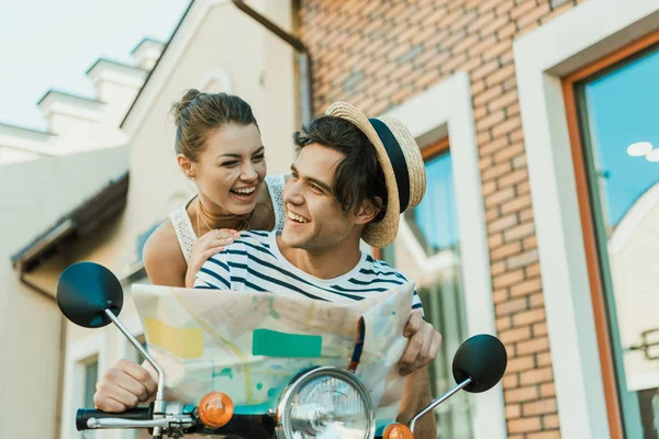 Couple in love with map — Stock Photo