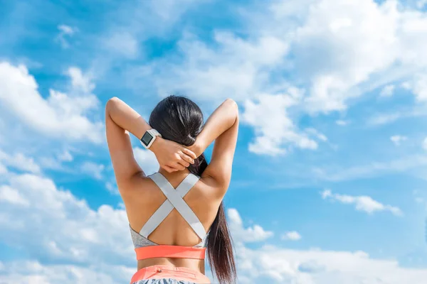 Sportswoman with smart watch — Stock Photo