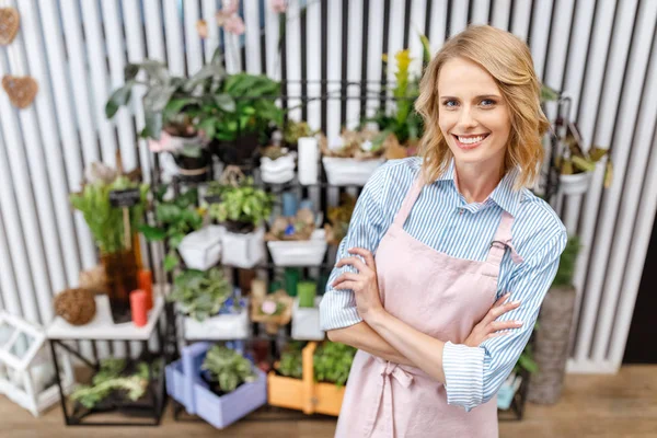 Smiling young florist — Stock Photo