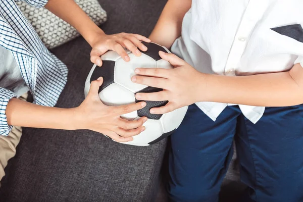 Boys holding soccer ball — Stock Photo