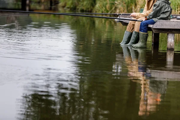 Father and son fishing on lake — Stock Photo