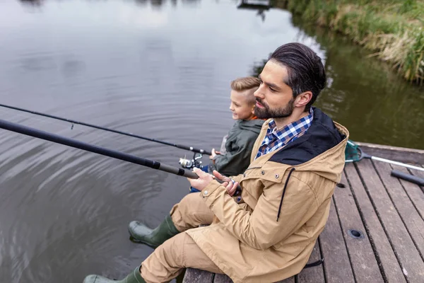 Father and son fishing together — Stock Photo