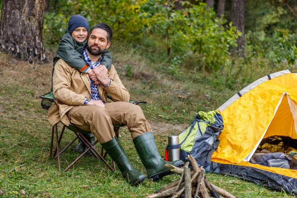 Happy father and son in camping — Stock Photo