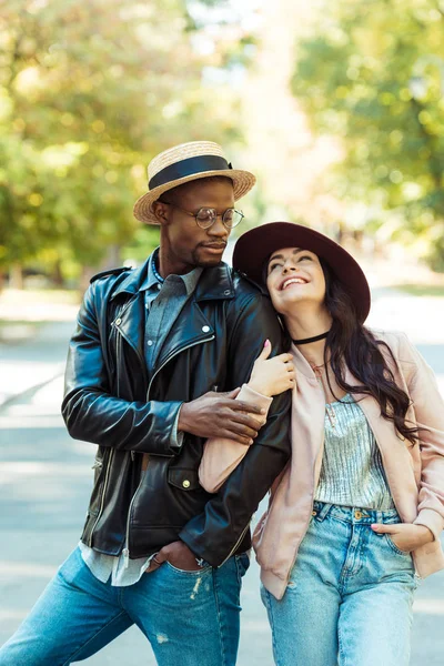 Girlfriend hugging her boyfriend on street — Stock Photo