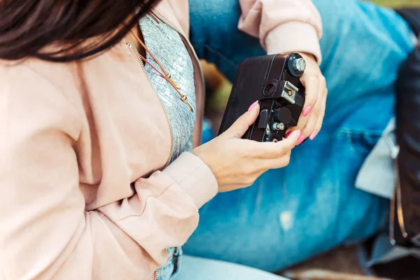 Woman holding analogue camera — Stock Photo