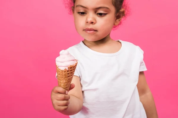 Child holding ice cream in hand — Stock Photo