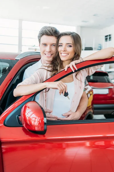 Boyfriend hugging girlfriend from back — Stock Photo