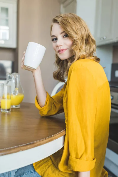 Woman drinking her morning coffee — Stock Photo