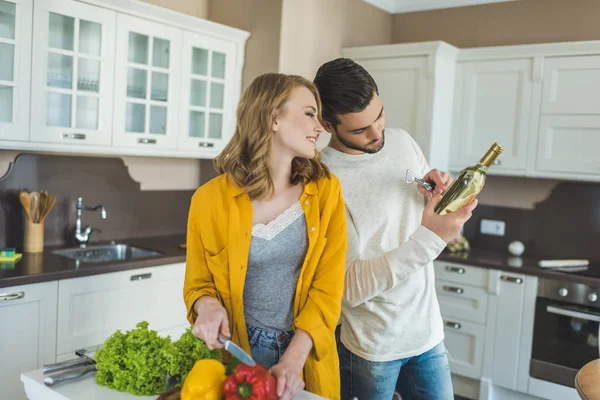 Young couple with wine — Stock Photo