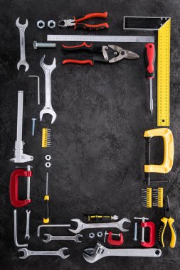 top view of set of various work tools on black clipart