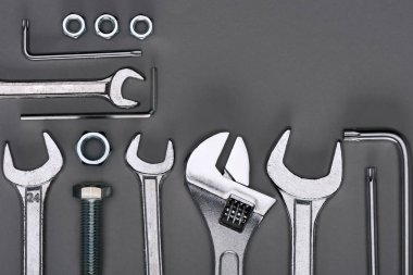 top view of set of various work tools on grey clipart