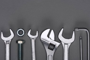top view of set of various work tools on grey clipart