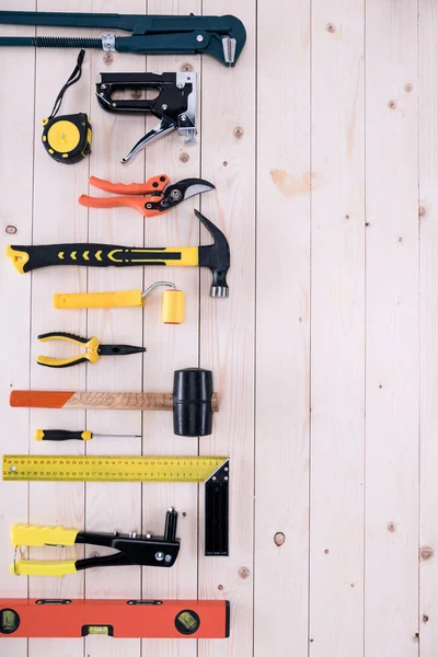 Top view of different tools on wooden tabletop with copy space — Stock Photo, Image