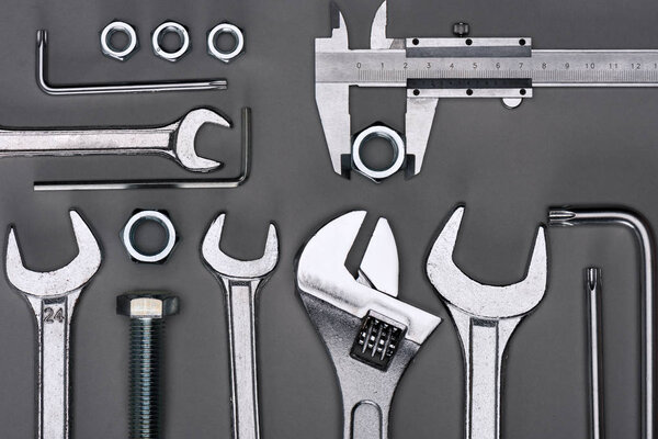 top view of set of various work tools on grey
