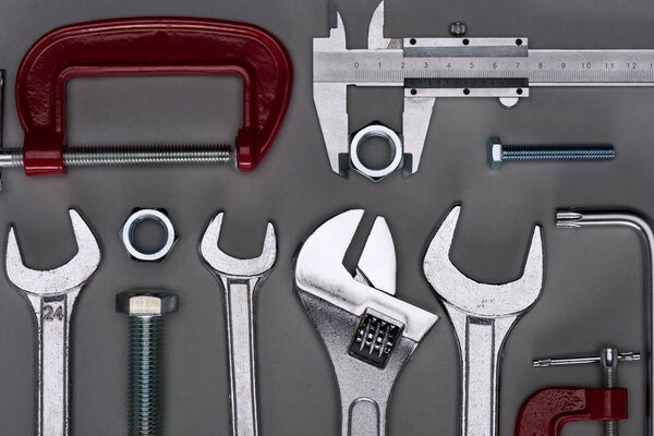 top view of set of  various work tools on grey
