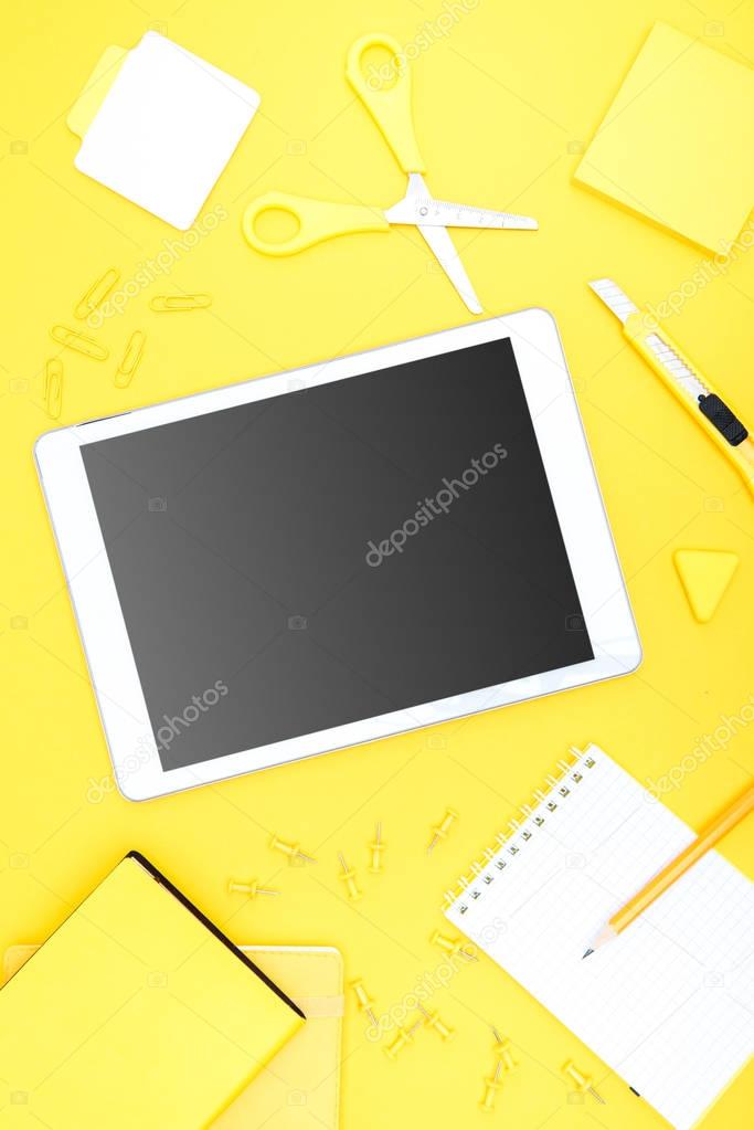 Digital tablet and office supplies 