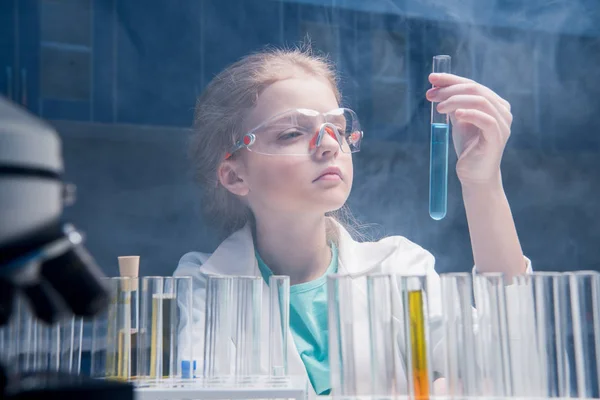 Girl in goggles with tube — Stock Photo, Image