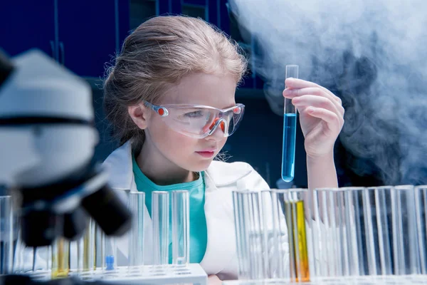 Girl in goggles with tube — Stock Photo, Image