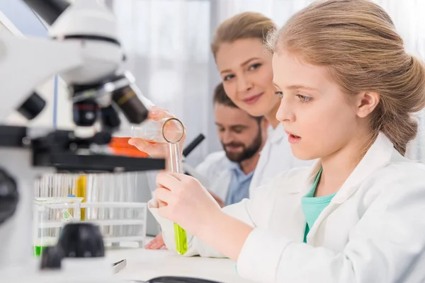 Little girl with flasks — Stock Photo, Image