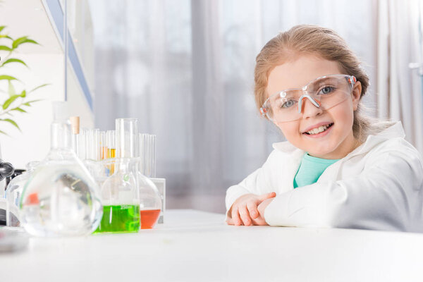 girl in goggles with flasks