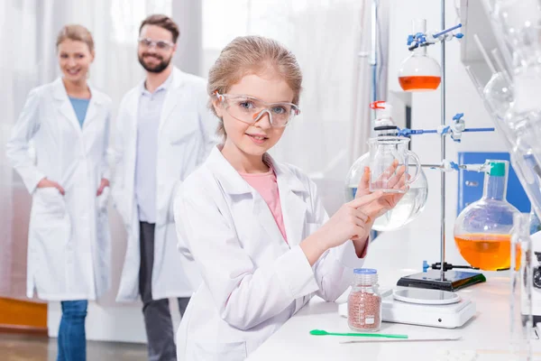 Teachers and student in lab