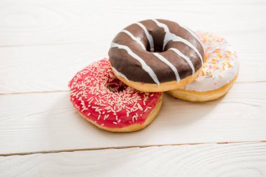 Tasty donuts with frosting clipart