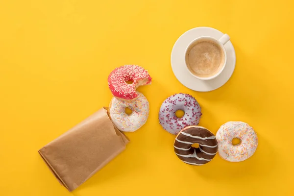 Cup of coffee and several donuts — Stock Photo, Image