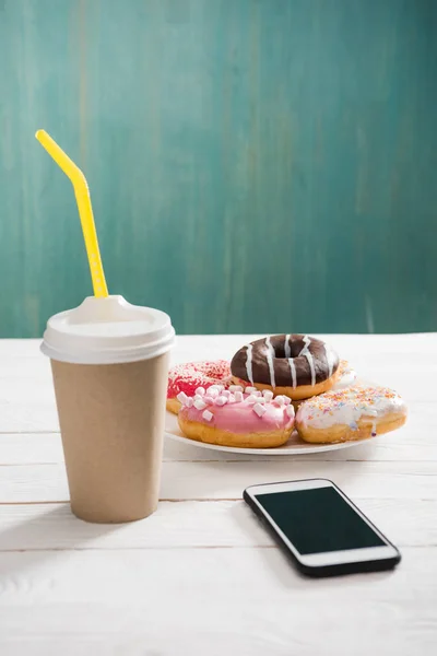 Frukost med kaffe och munkar — Stockfoto