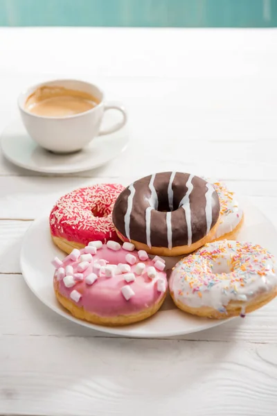 Donuts with cup of coffee for breakfast — Stock Photo, Image