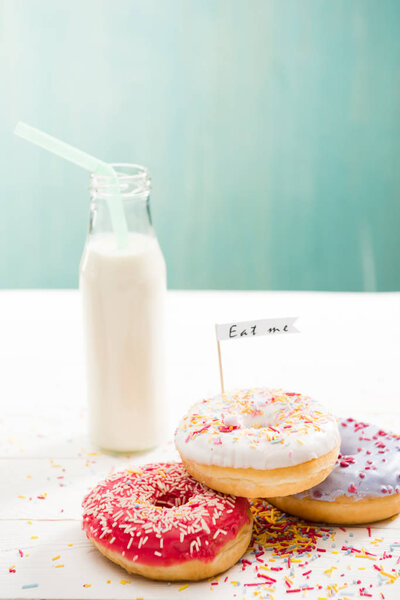 Donuts  with milkshake in bottle on the table