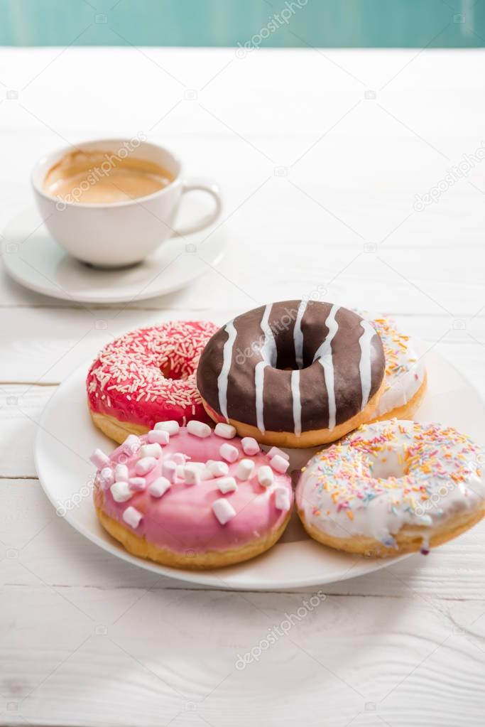 Donuts with cup of coffee for breakfast 