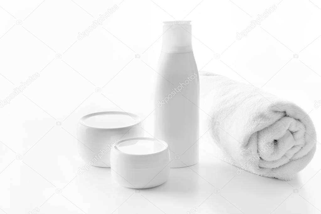 skin creams and towel