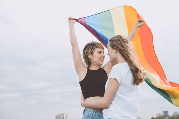 Homosexual couple with lgbt flag 