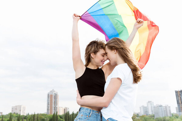 lesbian couple with lgbt flag
