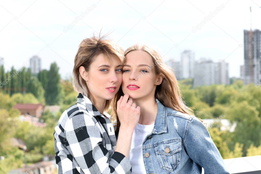 lesbian couple looking at camera