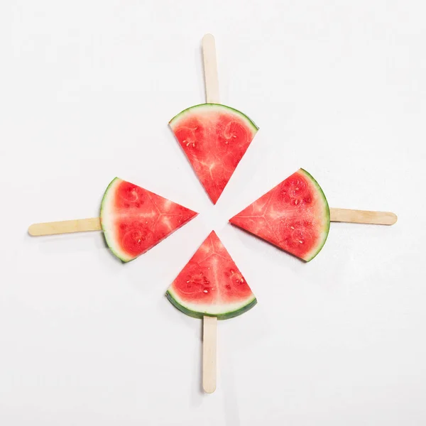 Watermelon slices on popsicle sticks — Stock Photo, Image