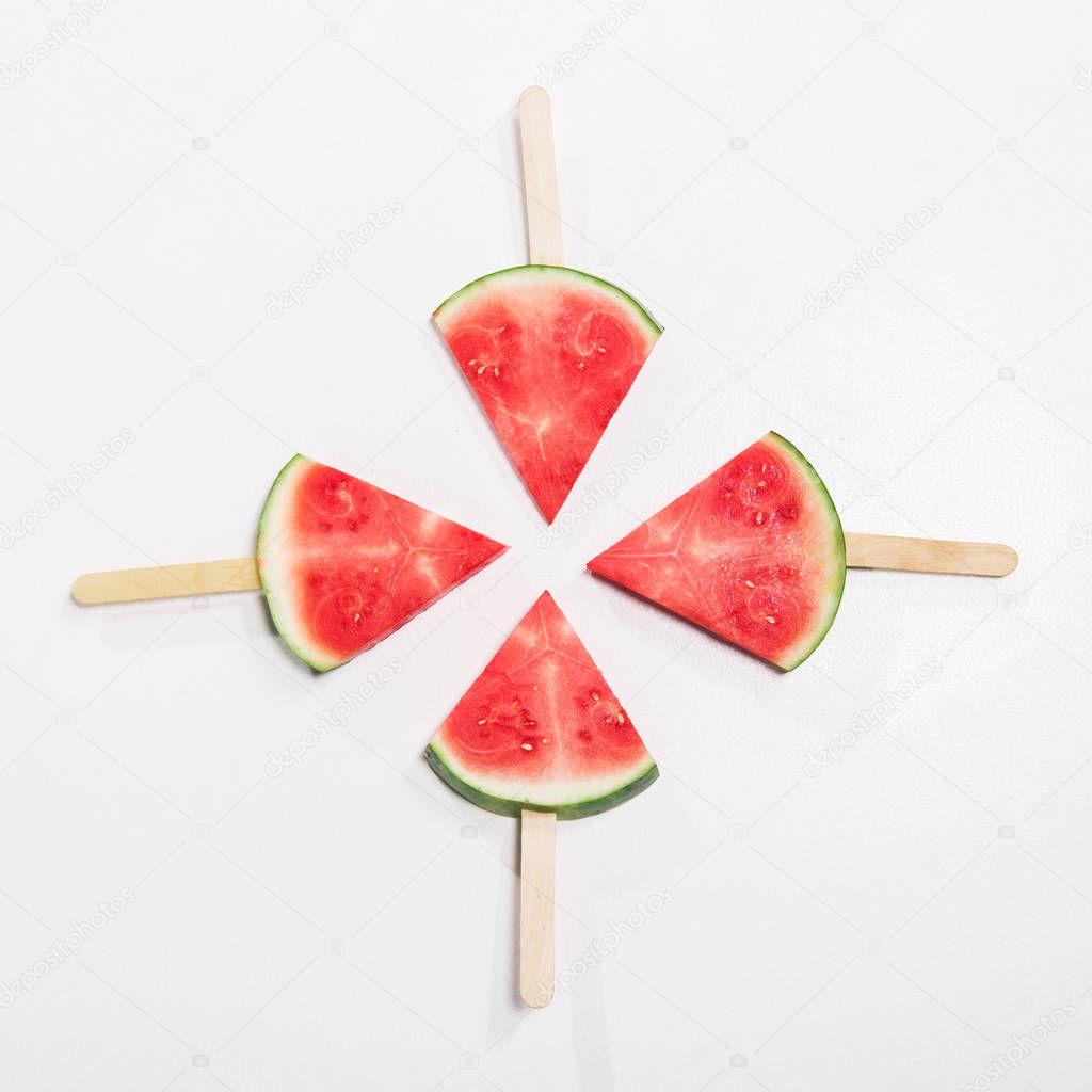watermelon slices on popsicle sticks