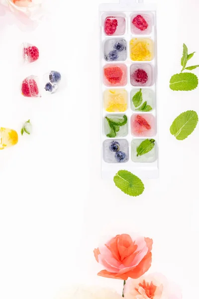 Berries in ice cubes — Stock Photo, Image