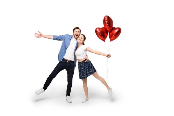 Couple with heart shaped balloons — Stock Photo, Image