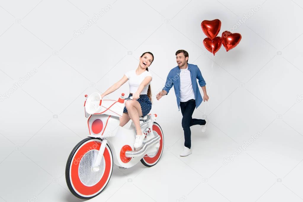 couple having fun with electric bike
