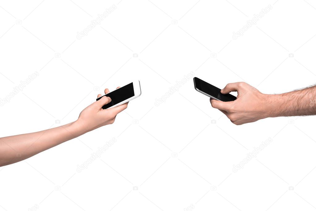 man and woman using smartphones