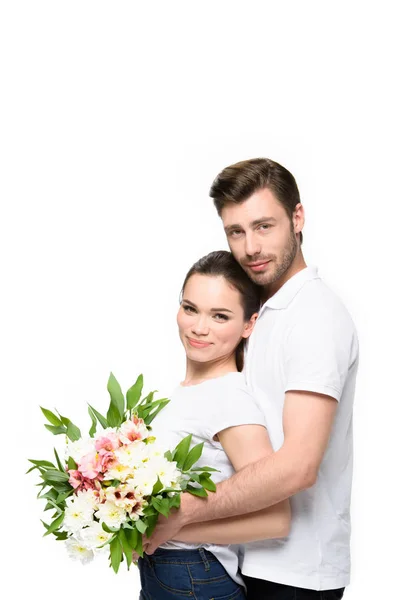 Couple with bouquet of flowers — Stock Photo, Image