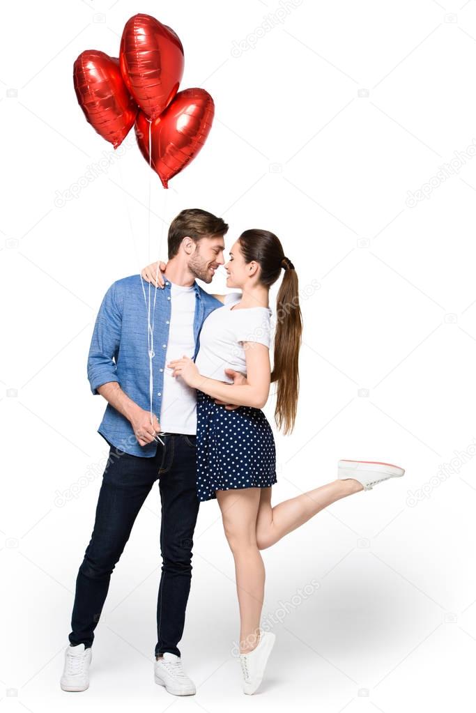 couple with heart shaped balloons 