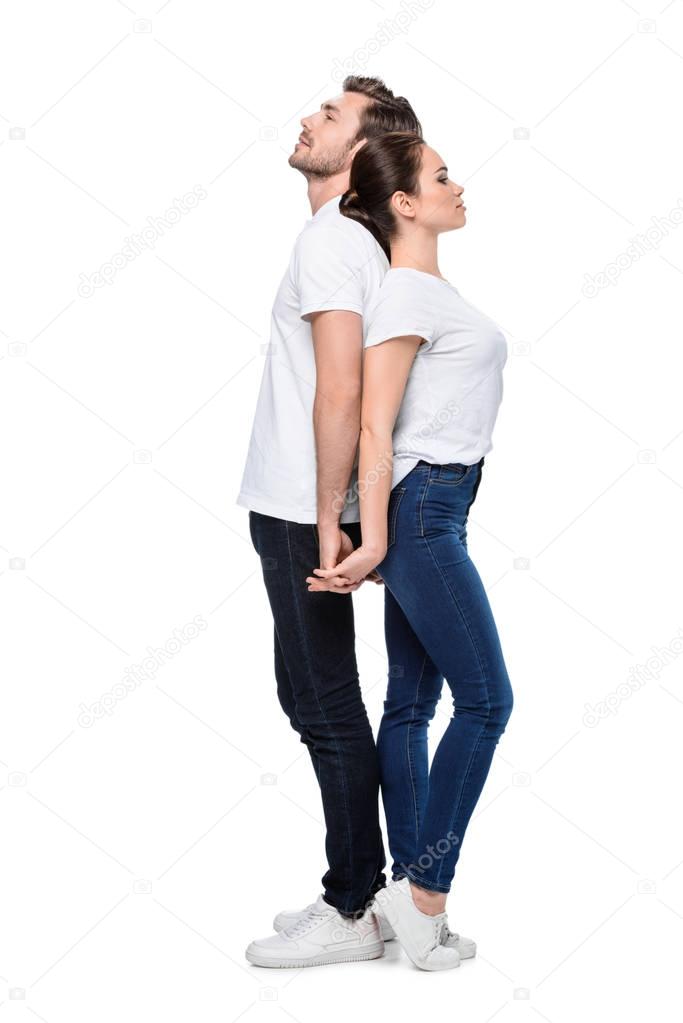 couple standing back to back