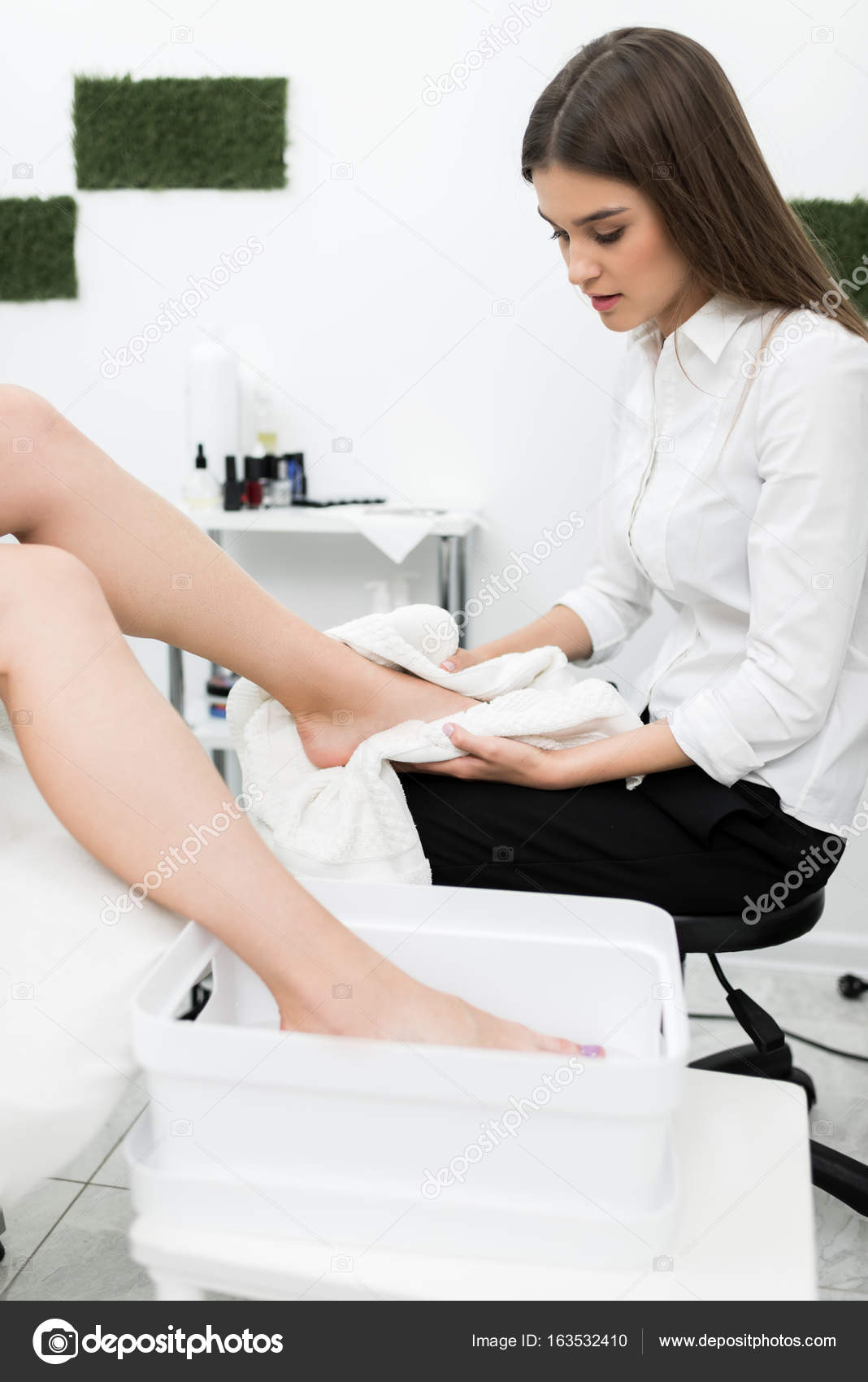Woman getting pedicure procedures — Stock Photo © DimaBaranow 163532410