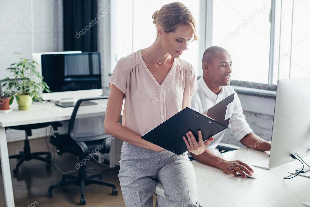 businessman and businesswoman in office