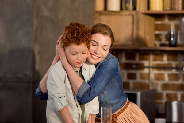 Mother hugging son — Stock Photo, Image